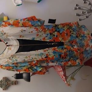 Floral orange and blue floral kimono with black tank and long gold necklace